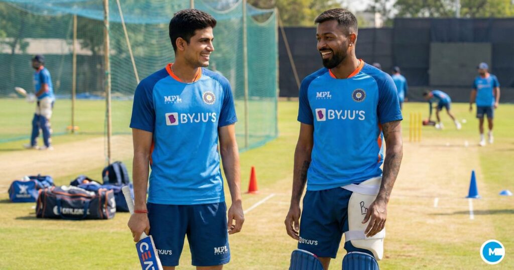 Indian cricket players Shubman Gill and Hardik Pandya in Team India blue jerseys at training ground, smiling confidently, cricket equipment visible, outdoor practice facility setting, bright natural lighting showing their return to fitness