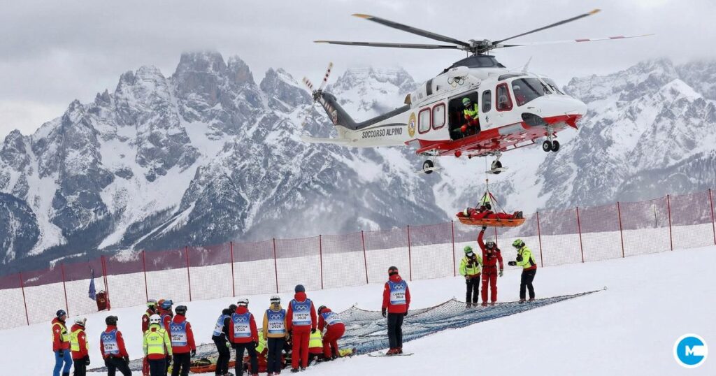 Olympic skier Lindsey Vonn being airlifted via helicopter from Cortina d'Ampezzo ski slope after crash, medical team attending, dramatic mountain backdrop, Winter Olympics 2026 medical emergency scene